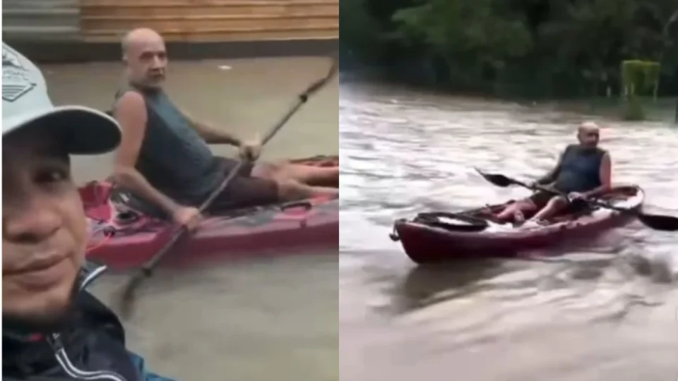 VÍDEO: dupla usa caiaque em rua alagada após forte chuva